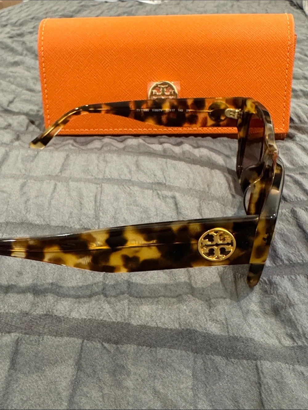 Tory Burch Tortoiseshell Sunglasses with Blue-Purple Lenses